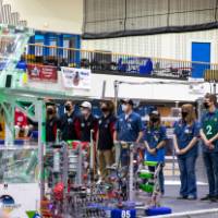 High scoring teams stand on the field preparing for the final competition